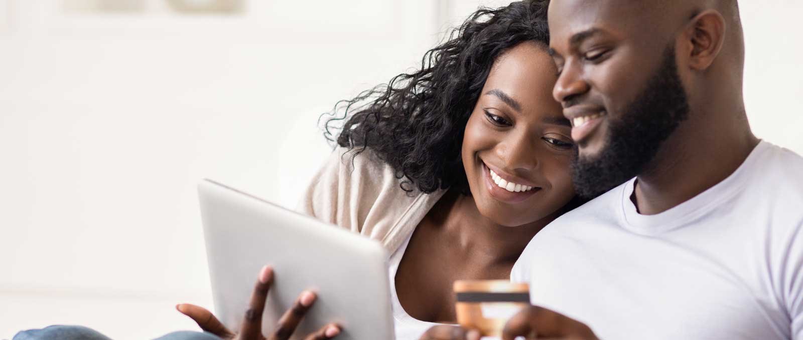 Young couple making an online purchase together thanks to persuasive marketing copywriting on the company’s website